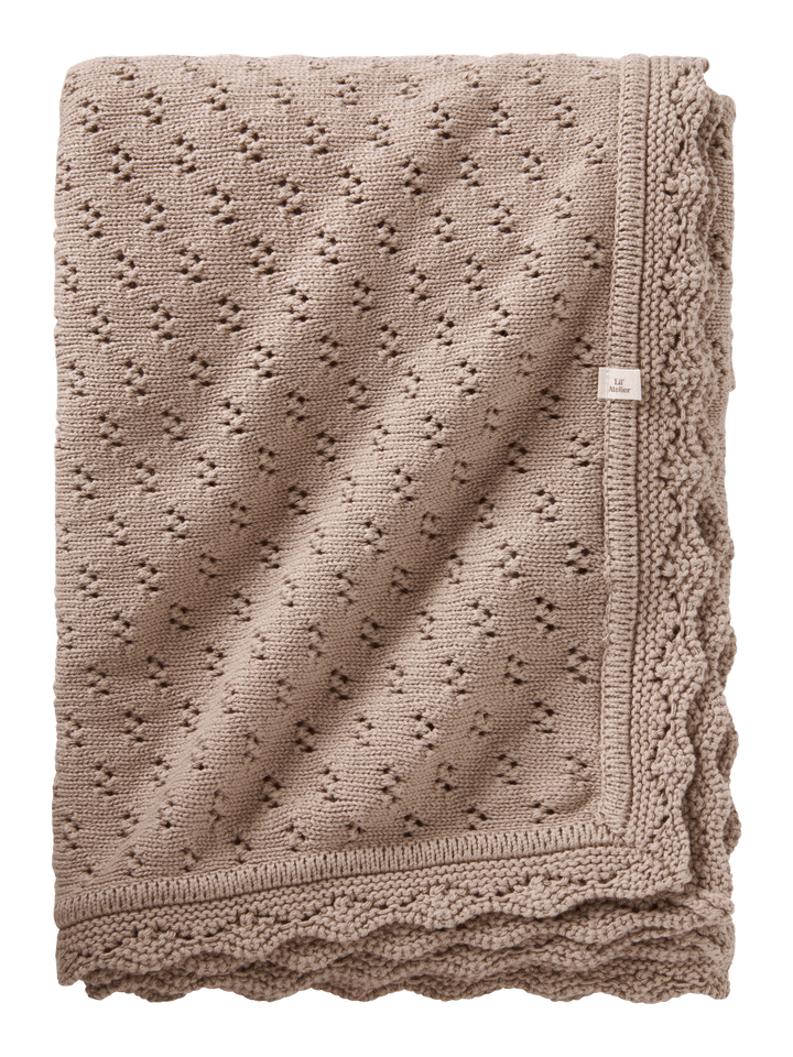 NBNNILIO STRIKKET TEPPE